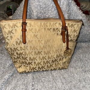 “On Hold”…Michael Kors Tan Monogram Tote